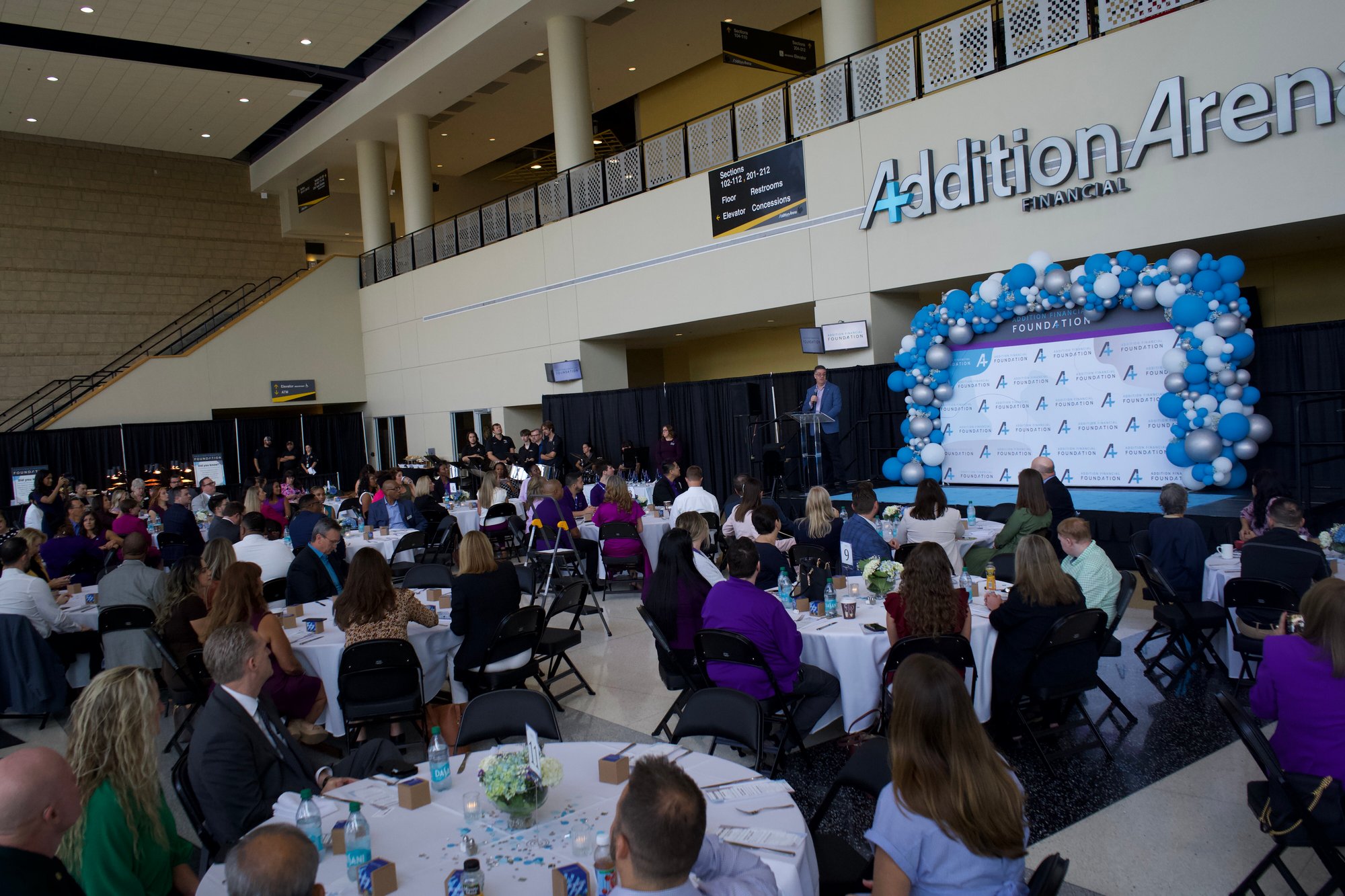 Group of attendees inside Addition Arena